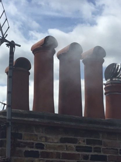 Chimney sweeping in exeter, checking the smoke on cannon chimney pots. Hodgsons chimney sweeps noticed the terminals are incorrect