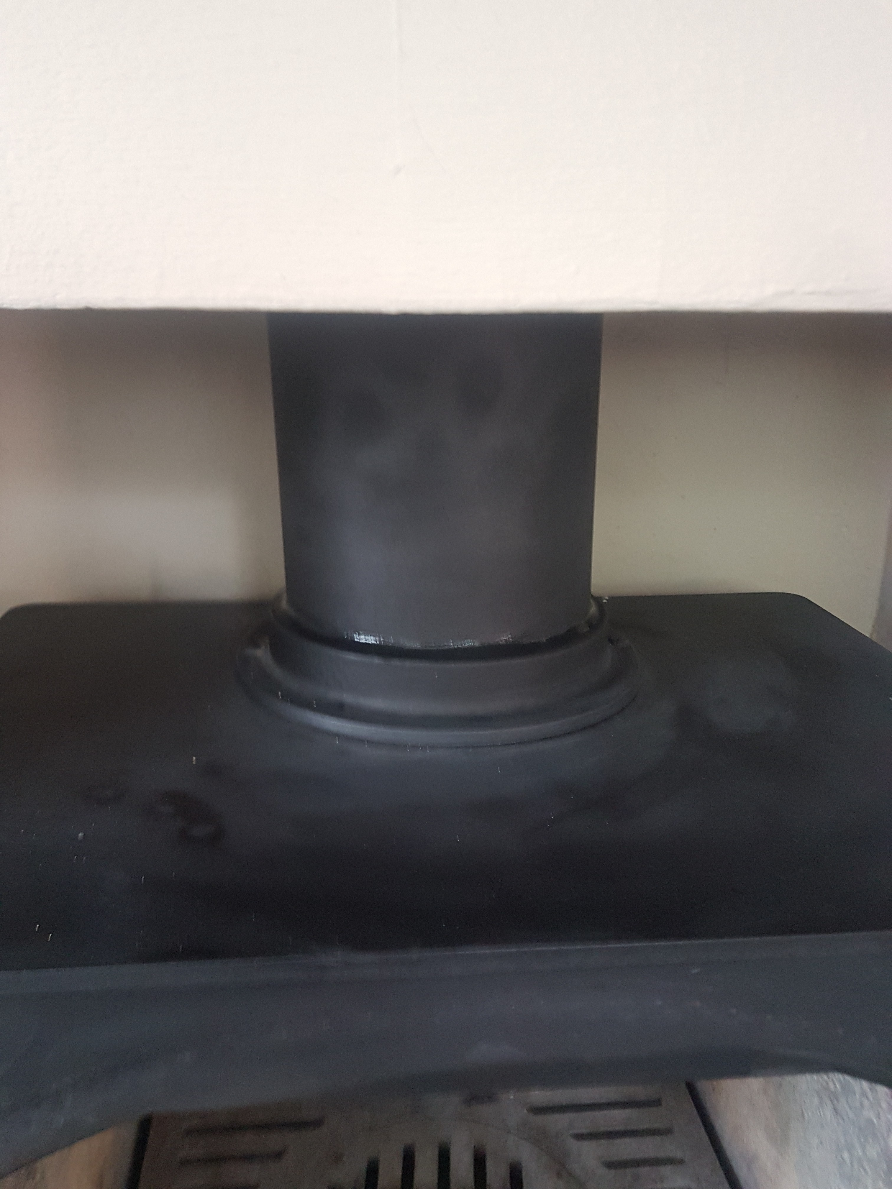 Hodgsons Chimney Sweeps replace the fire cement, creating a seal between the flue collar and flue pipe in Goodrington, Devon